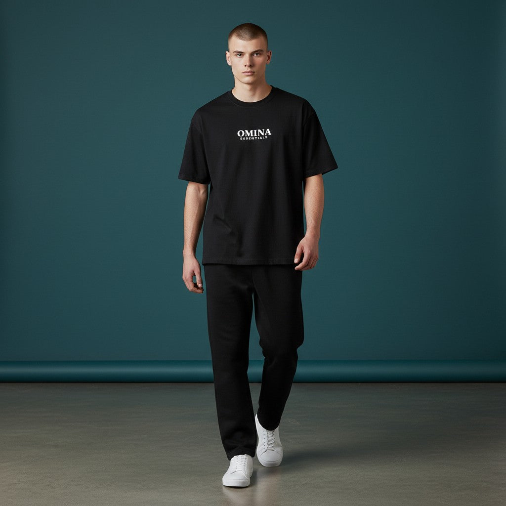 OMINA Essentials black heavyweight cotton t-shirt with crew neck and relaxed fit, worn by a male model.