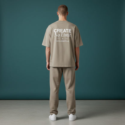 Omina Essentials No Limit heavyweight cotton t-shirt in beige with a relaxed fit and crew neck. Features graphic text on back.