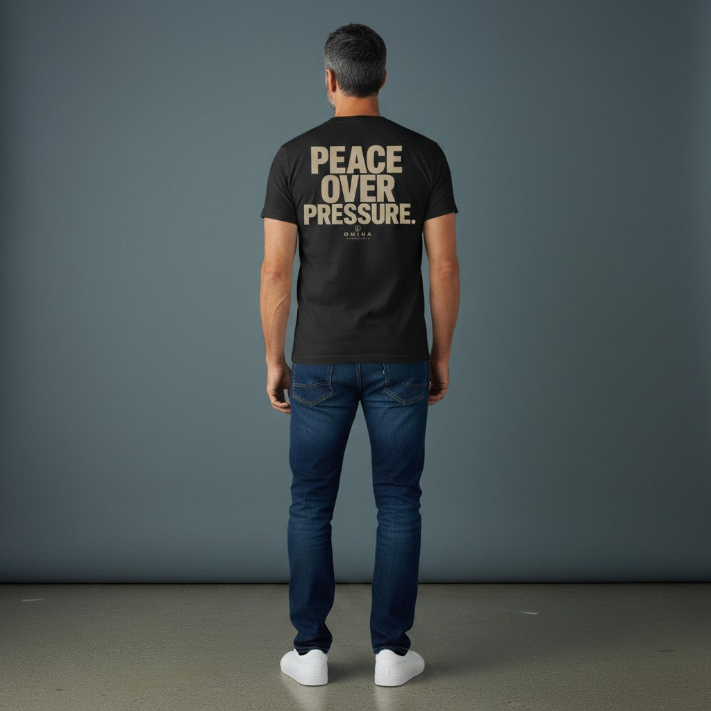 Omina Essentials black heavyweight cotton t-shirt with "PEACE OVER PRESSURE" graphic and logo on back.
