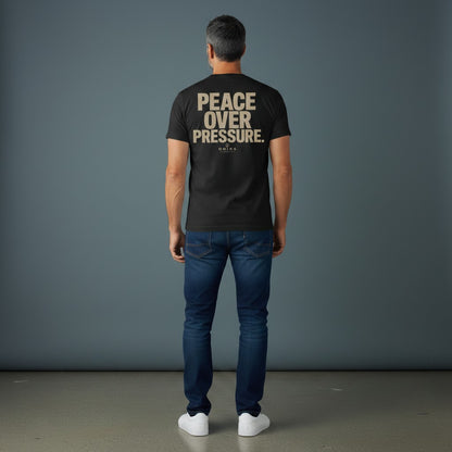 Omina Essentials black heavyweight cotton t-shirt with "PEACE OVER PRESSURE" graphic and logo on back.