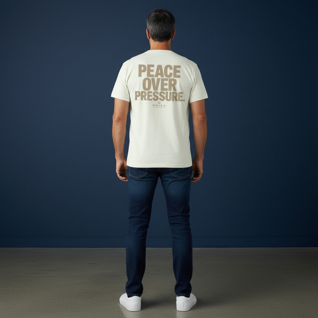 Omina Essentials cream heavyweight cotton t-shirt with large taupe 'PEACE OVER PRESSURE' graphic and logo.