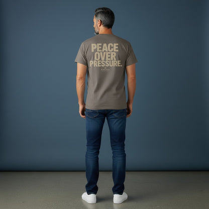 Omina Essentials grey heavyweight cotton t-shirt with "PEACE OVER PRESSURE" graphic and logo on back.