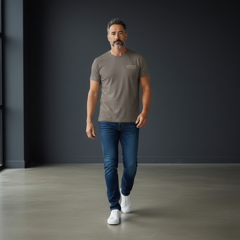 Omina Essentials taupe heavyweight combed ring-spun cotton t-shirt with minimalist logo on chest. Relaxed oversized fit.