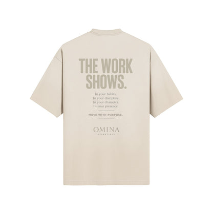 Omina Essentials The Work Shows T-Shirt in beige cotton with graphic text on back.
