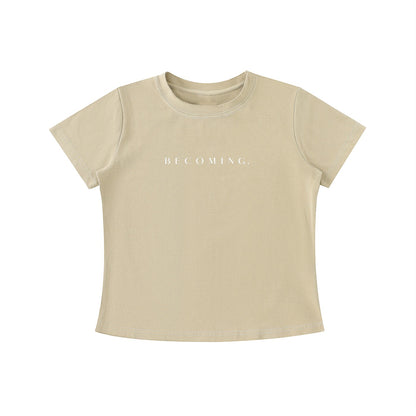OMINA Essentials beige cotton t-shirt with 'BECOMING.' text in white, vintage wash, slim fit.