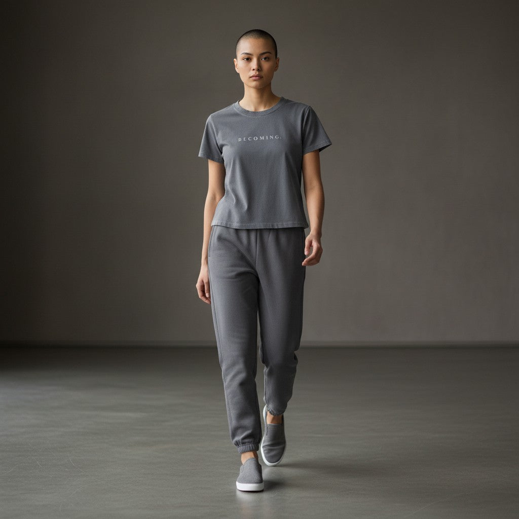 OMINA Essentials grey cotton t-shirt with 'BECOMING.' printed in white on the chest. Vintage wash, slim fit.