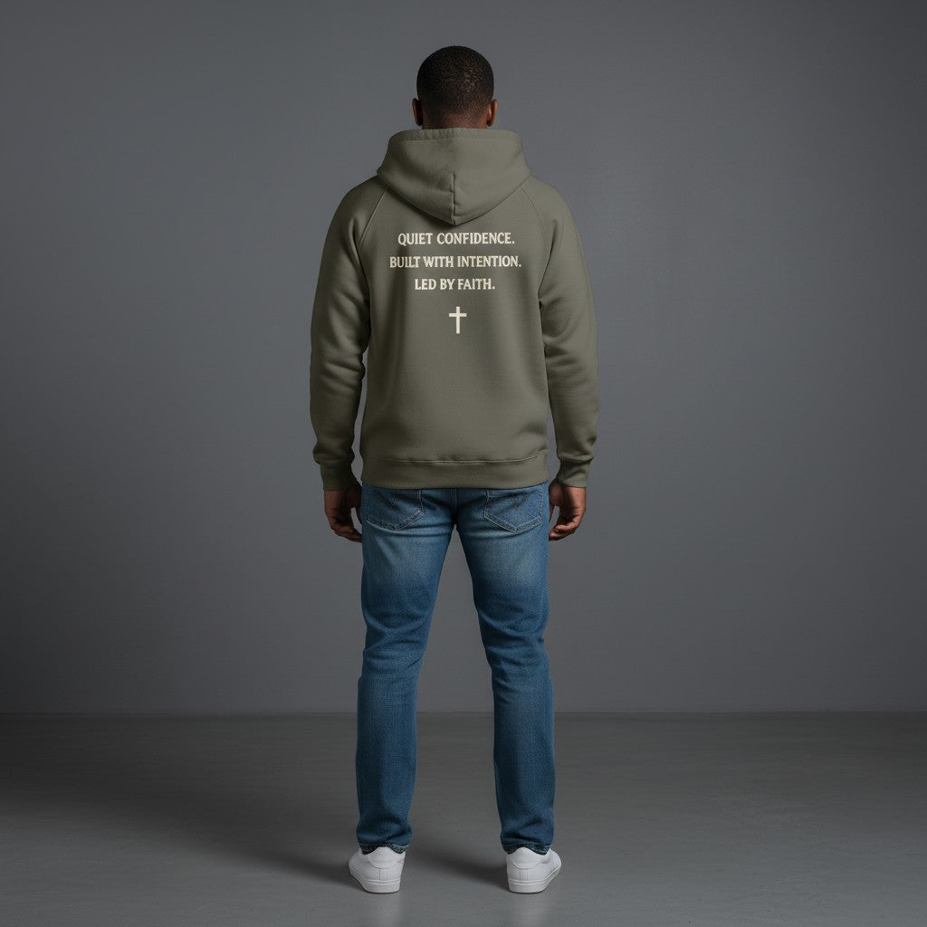 Omina Studio grey heavyweight cotton pullover hoodie with "Quiet Confidence. Built With Intention. Led By Faith." graphic and cross.