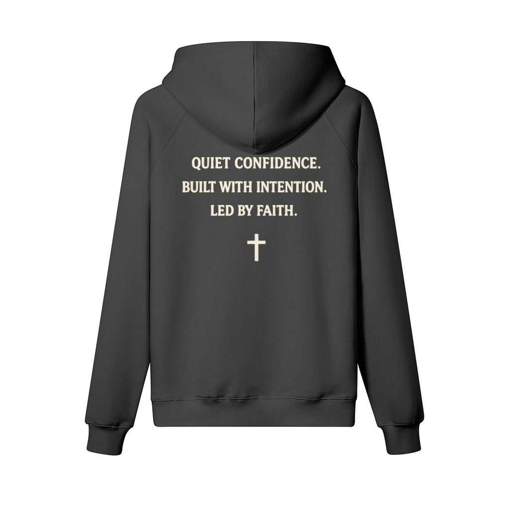 Omina Studio dark grey heavyweight cotton pullover hoodie with "Quiet Confidence. Built With Intention. Led By Faith." text and a cross graphic.