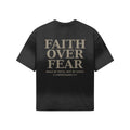 OMINA Studio black heavyweight cotton t-shirt with "FAITH OVER FEAR" graphic and Bible verse 2 Corinthians 5:7.