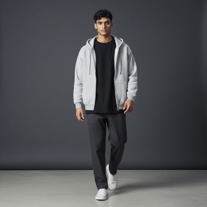 Omina grey boxy fleece zip hoodie with drop shoulders worn by a male model over a black t-shirt and dark trousers.