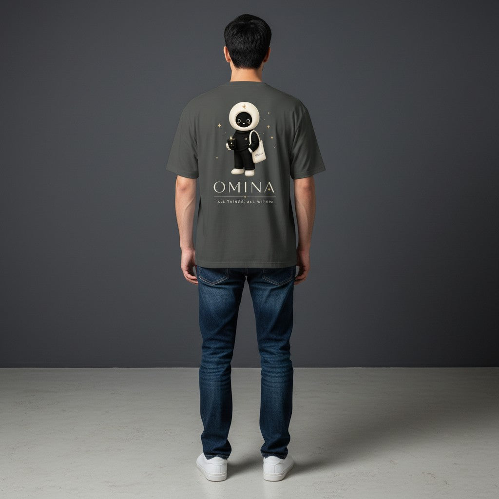 Back view of a man wearing a grey Omina cotton crew neck t-shirt featuring the O mascot graphic and brand text.