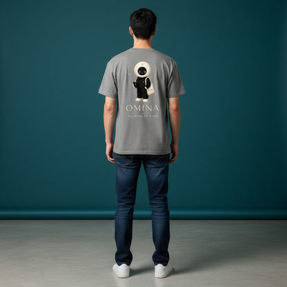 Model wearing a grey Omina unisex cotton t-shirt with a back graphic of the O mascot and Omina Studio branding.