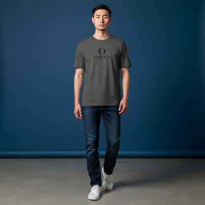 A man wearing an Omina grey cotton crew neck t-shirt with a black Omina Studio mascot logo, paired with blue jeans.
