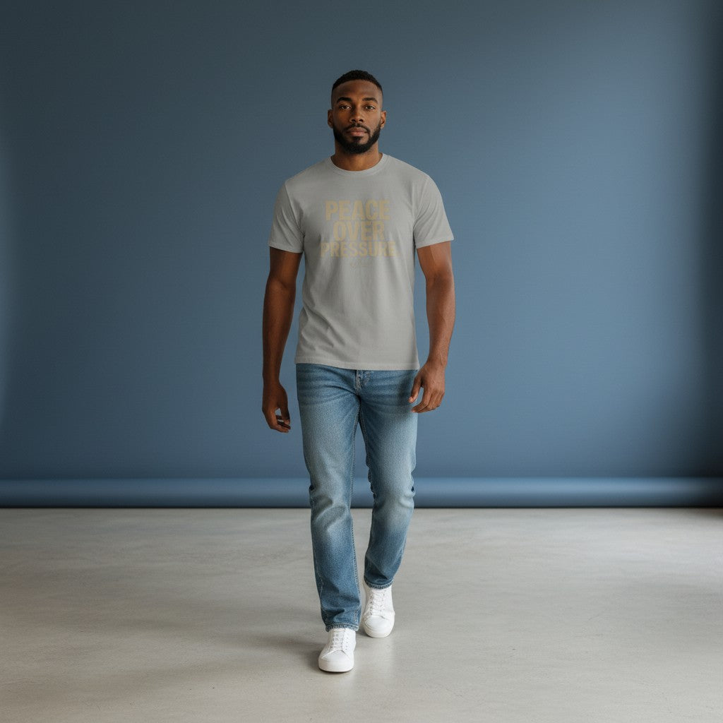 Omina model wearing a grey heavyweight cotton t-shirt with PEACE OVER PRESSURE text, styled with blue jeans and sneakers.