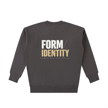 OMINA Studio heavyweight cotton sweatshirt in charcoal grey with "FORM / IDENTITY BUILT WITH INTENTION" graphic on back.