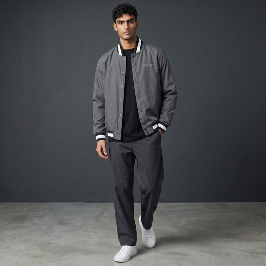 Omina grey insulated varsity jacket with white striped collar, cuffs, and hem. Water-resistant exterior.