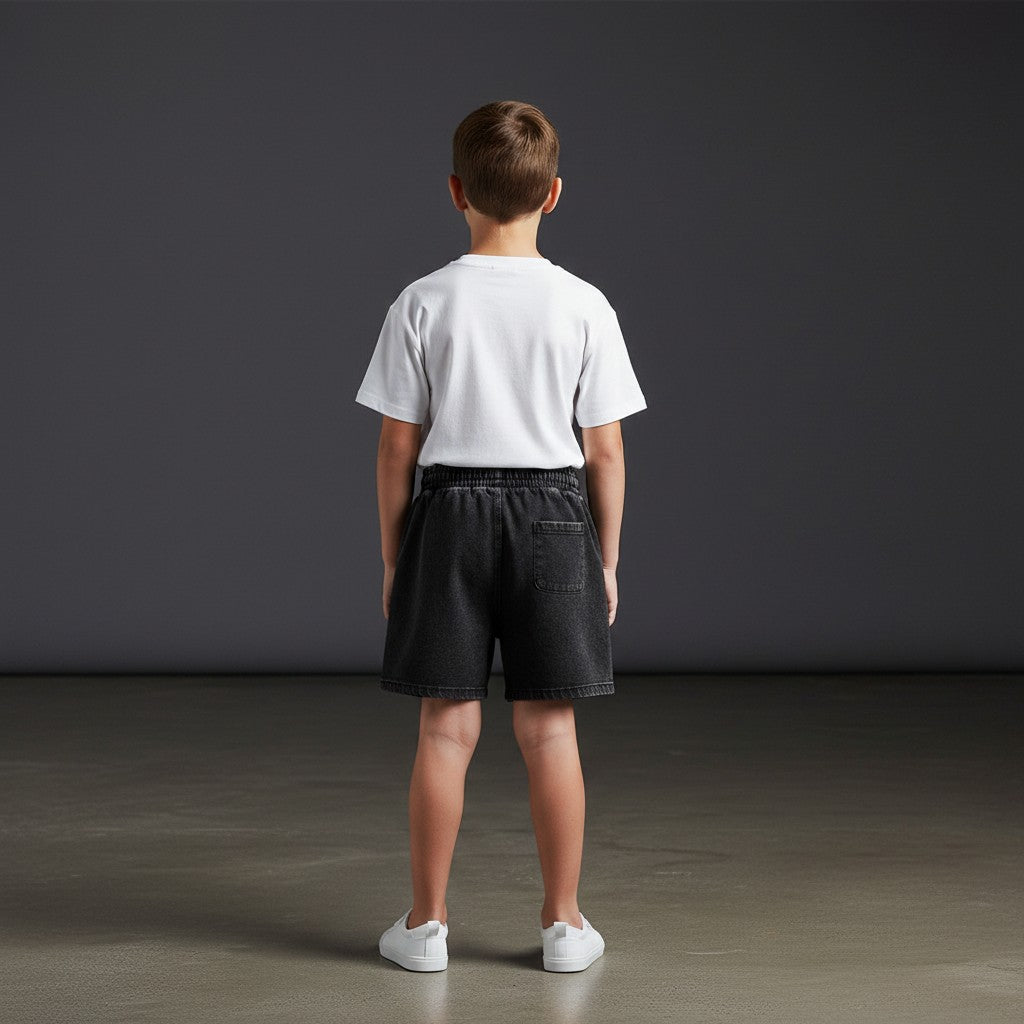 Omina Kids black snow-washed shorts with elastic waistband and single back pocket. Relaxed fit.