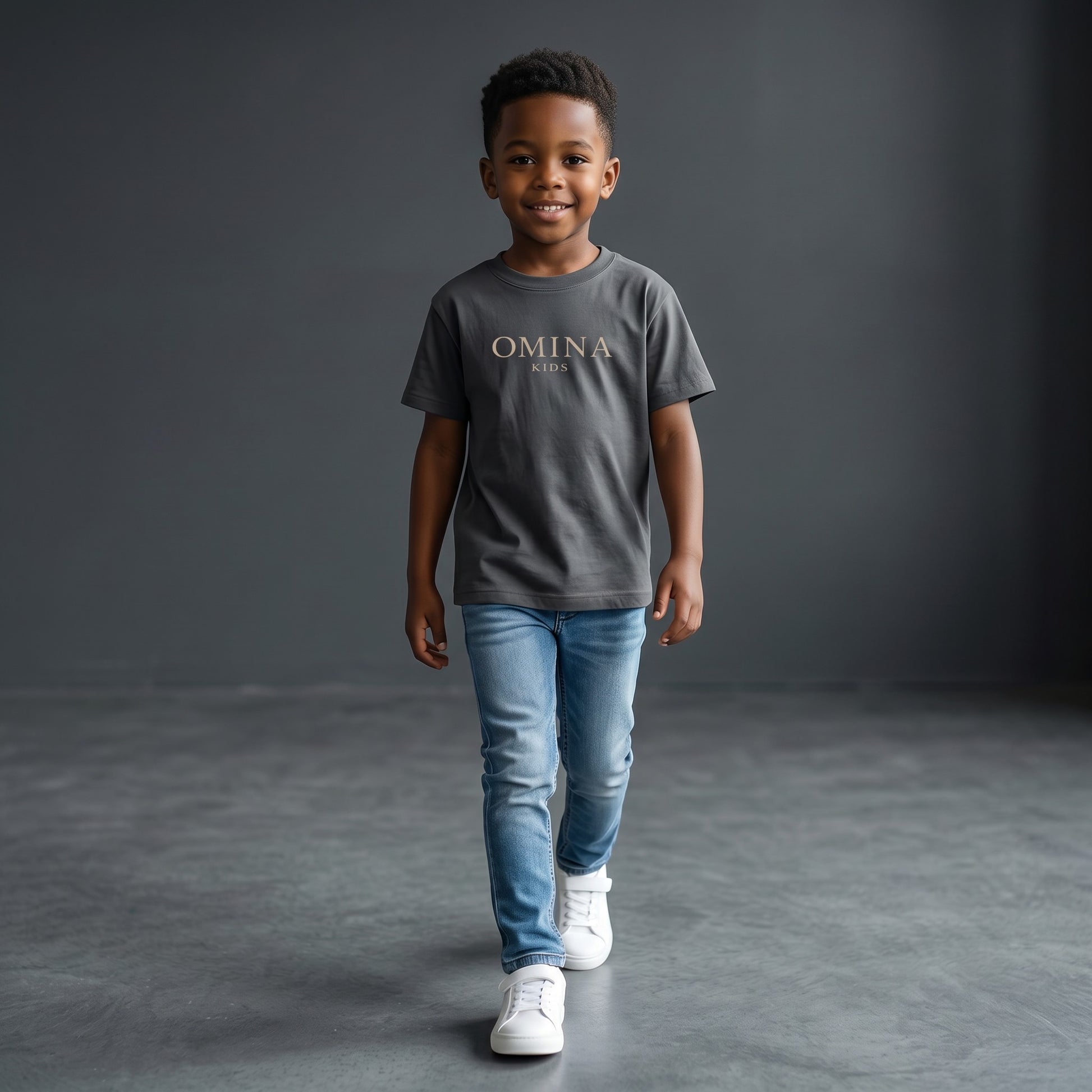 Omina Kids essential t-shirt in dark grey, made from soft, breathable fabric with a relaxed fit and subtle Omina Kids branding.