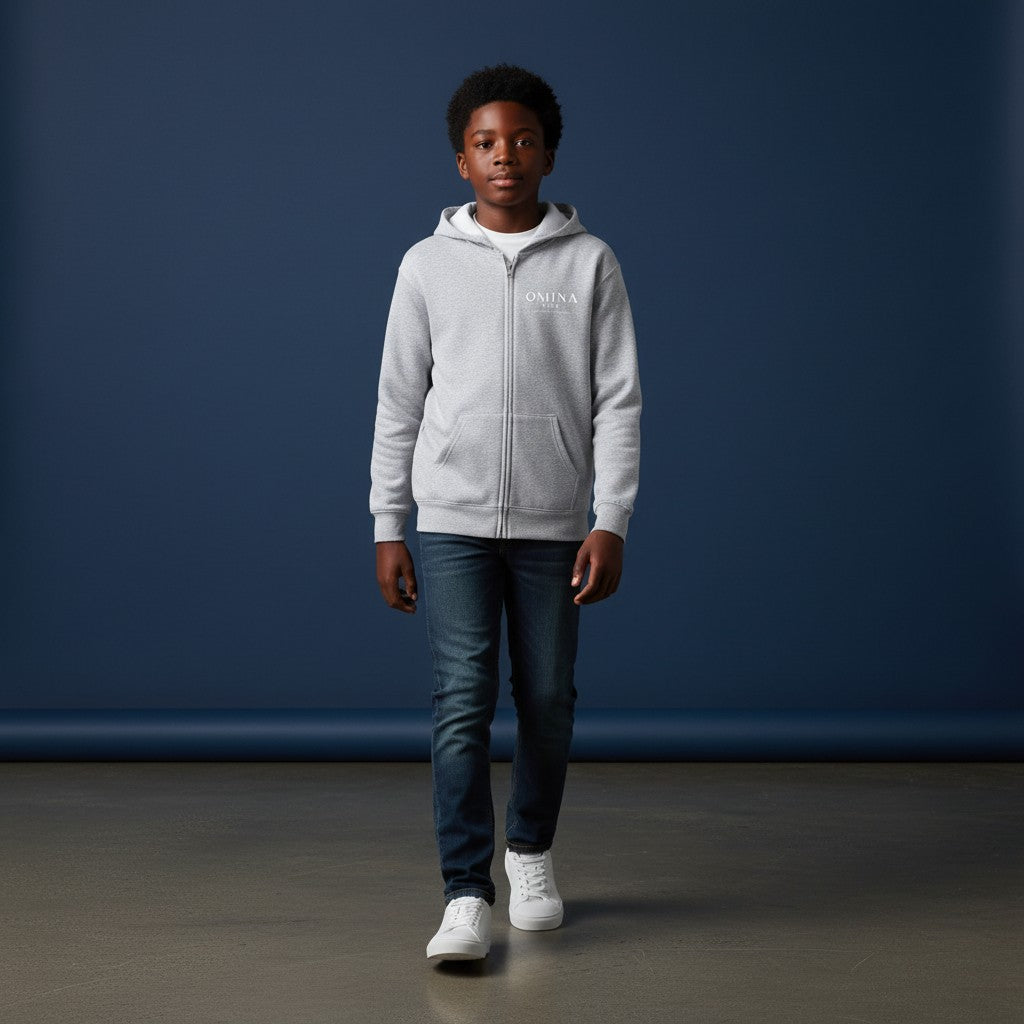 Omina Kids light grey full zip hoodie with minimalist logo on chest and "Future In Motion" graphic on back.