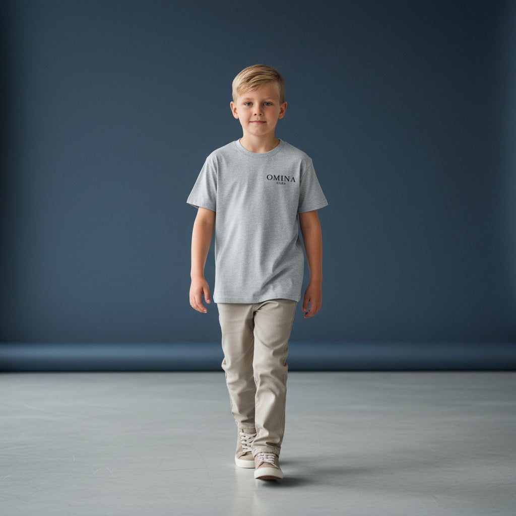 Omina Kids grey Sorona quick-dry cooling t-shirt with minimal logo on chest. Soft, breathable, and lightweight.