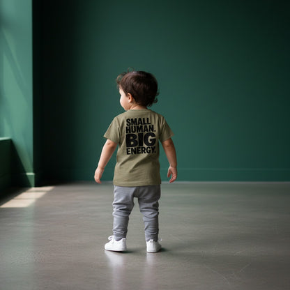 Omina Kids toddler tee in tan with black text reading "SMALL HUMAN. BIG ENERGY."