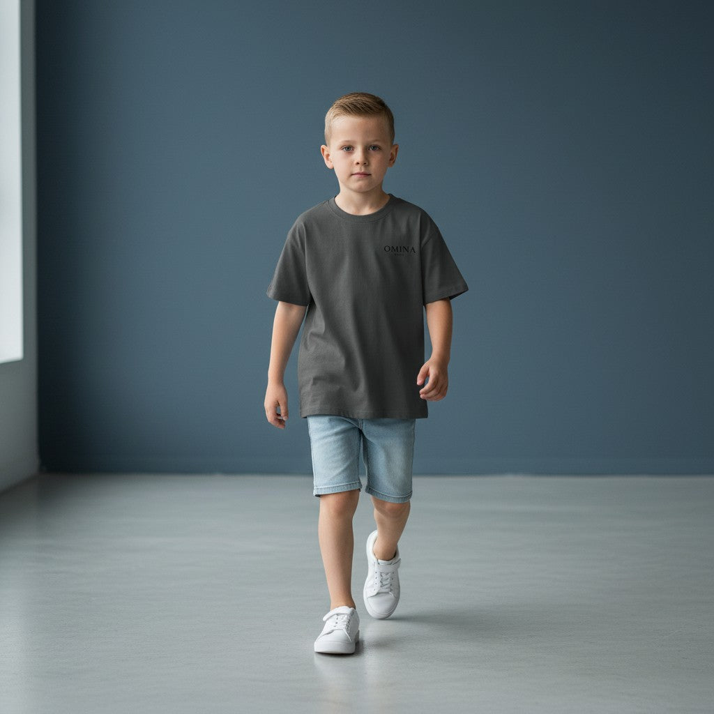 Omina Kids charcoal grey Sorona quick-dry cooling t-shirt with minimal logo on chest. Relaxed fit, crew neck, short sleeves.