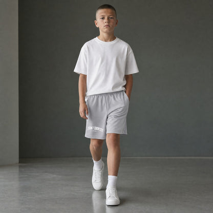 Omina Kids Youth Form / Identity shorts in light grey with elastic waistband and white graphic logo on left leg.