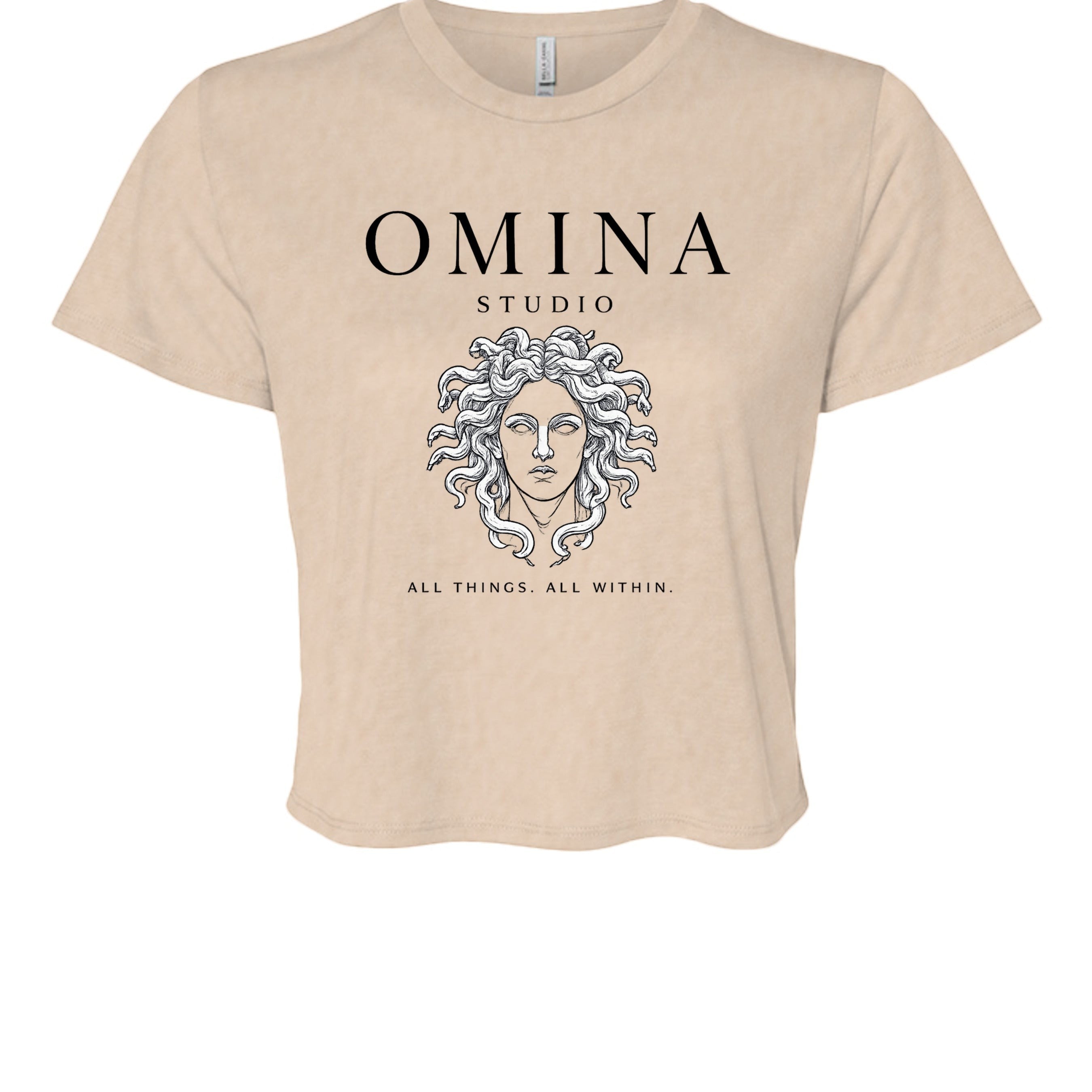 Omina Studio beige cropped t-shirt with Medusa graphic and text "All Things. All Within."