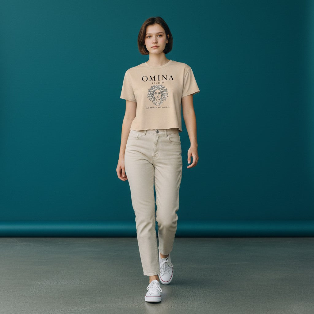 Omina Studio beige cropped t-shirt with Medusa graphic and text "All Things. All Within."