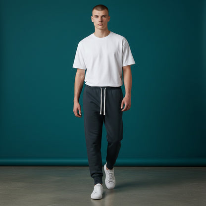 Omina Men's dark grey tapered leg drawstring joggers made from polyester and spandex blend.