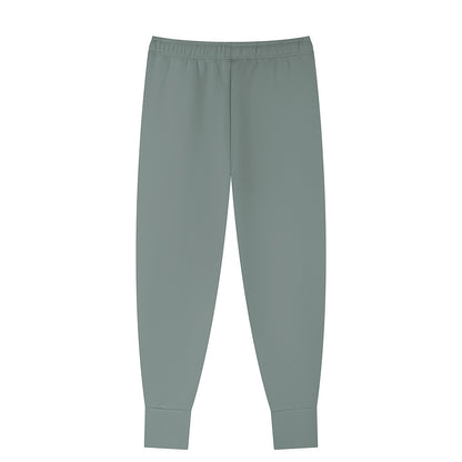 Omina men's tapered leg joggers in a muted green. Made from a polyester-spandex blend with a drawstring waist and cuffed ankles.