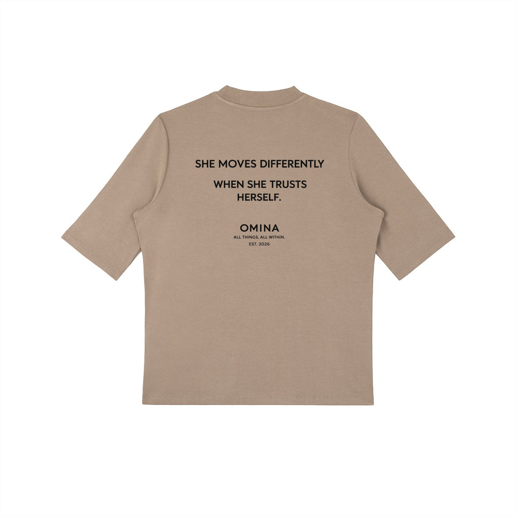 Omina taupe viscose and spandex blend short sleeve mock neck t-shirt with graphic text on back.