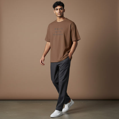 Omina brown heavyweight cotton t-shirt with "MOVE WITH PURPOSE." graphic on chest. Relaxed fit, crew neck.