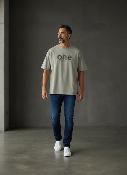 Omina men's oversized light grey short sleeve t-shirt with 'one' graphic and text detail. Made of 95% cotton, 5% spandex.