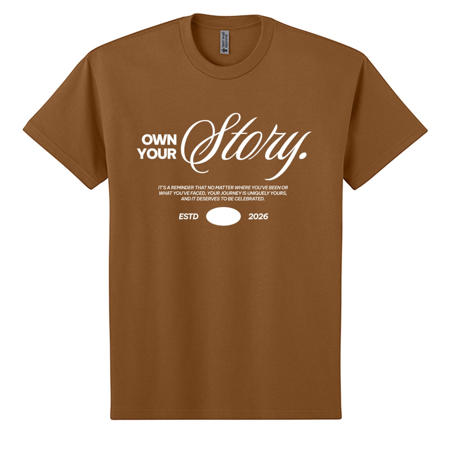 Omina brown heavyweight cotton oversized t-shirt with white "Own Your Story" graphic and "ESTD 2026" text.