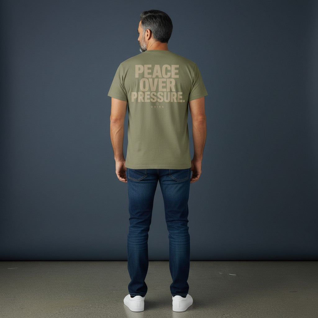 Omina Essentials olive green cotton t-shirt with "PEACE OVER PRESSURE" graphic and Omina branding on back.