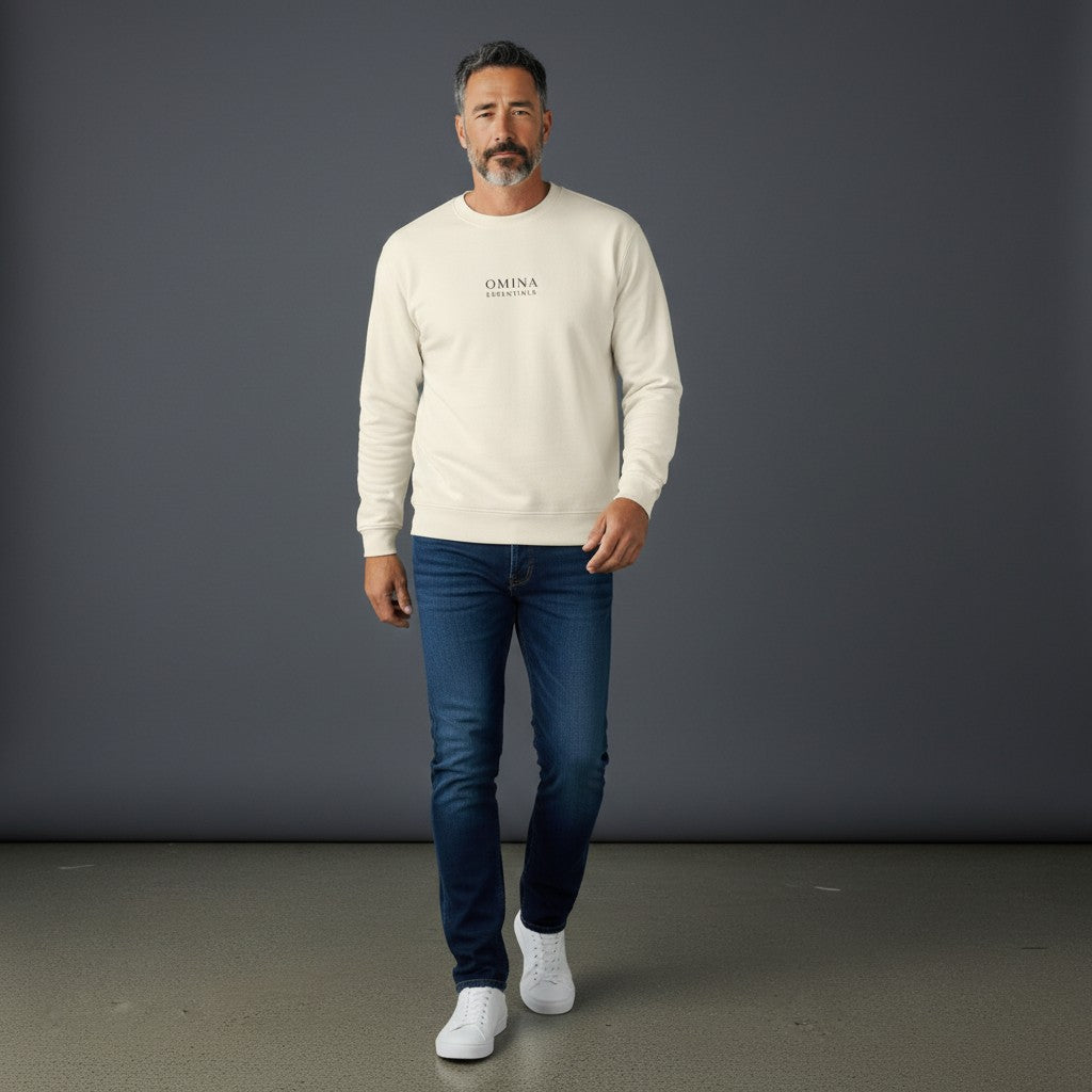 Model wearing an Omina cream heavyweight cotton long sleeve shirt with a relaxed fit and minimalist logo branding.
