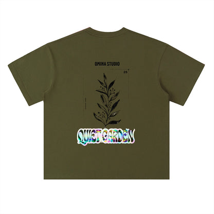 Omina Studio olive green heavyweight cotton t-shirt with drop shoulders and a graphic print of a plant and "Quiet Garden" text.