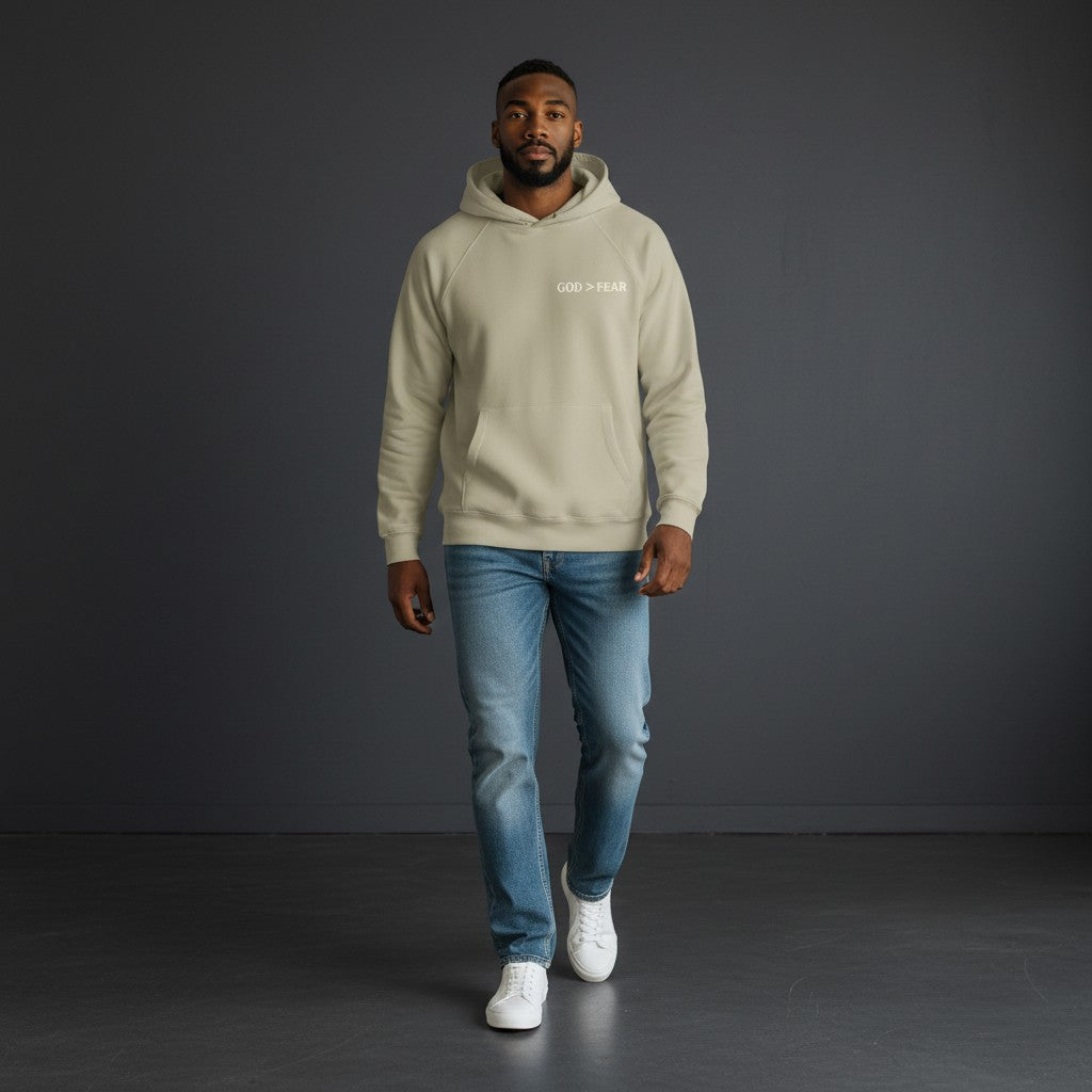 Omina Studio beige heavyweight cotton pullover hoodie with "GOD > FEAR" graphic and front kangaroo pocket.