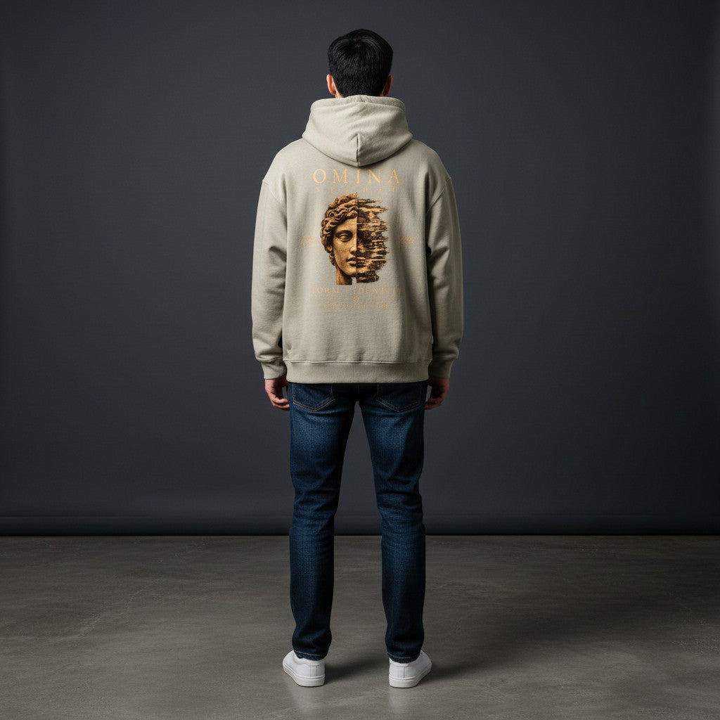 Omina Studio beige heavyweight fleece hoodie with a graphic print of a split face and text "FORM IDENTITY"