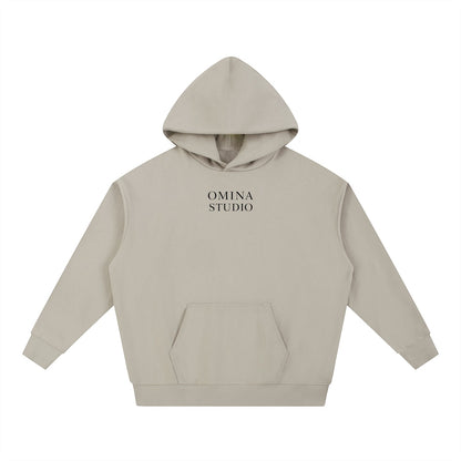 Omina Studio beige heavyweight cotton hoodie with relaxed oversized fit and front pocket. Minimalist design.