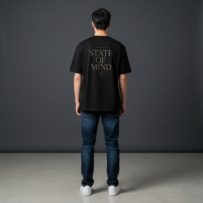 Omina Studio black cotton blend t-shirt with "STATE OF MIND" graphic print on back.