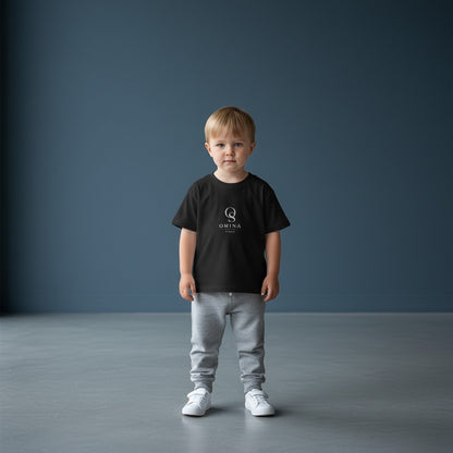 Omina Studio black infant t-shirt made from soft, breathable fine jersey cotton with a classic fit and minimalist logo.