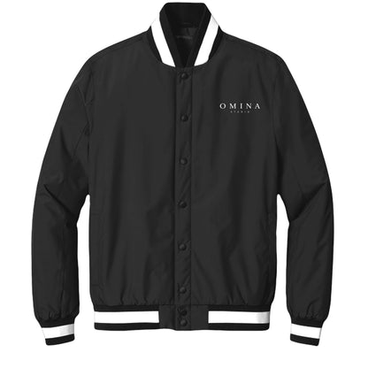 OMINA Studio black insulated varsity jacket with white striped collar, cuffs, and hem. Water-resistant.