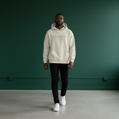 Omina Studio cream hoodie with 'OMINA FORM / IDENTITY' graphic print. Classic streetwear style.