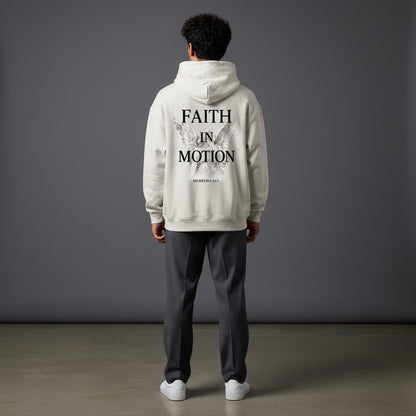Omina Studio light heather grey heavyweight hoodie with "FAITH IN MOTION" text and angel graphic on back.