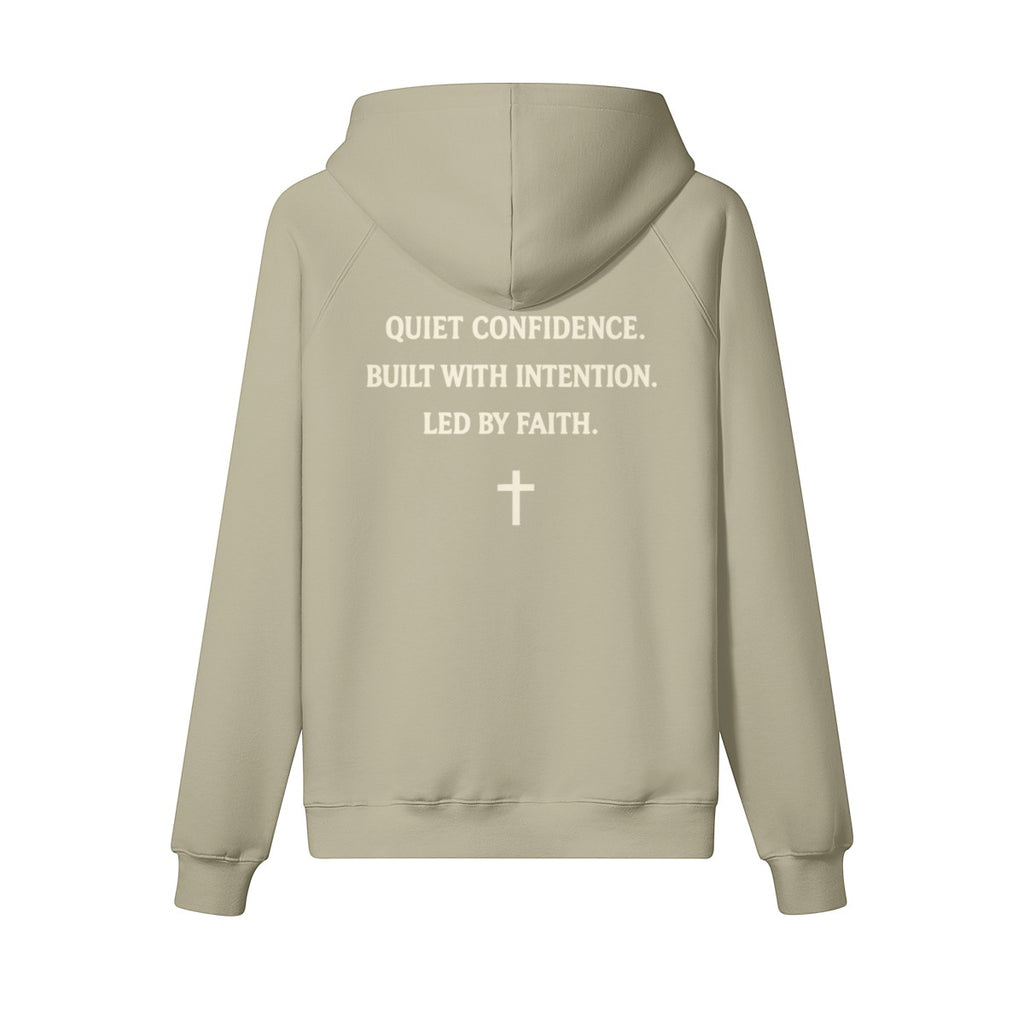 Omina Studio beige cotton pullover hoodie with "Quiet Confidence. Built With Intention. Led By Faith." text and a cross graphic.