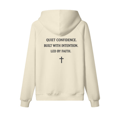 Omina Studio cream heavyweight cotton pullover hoodie with "Quiet Confidence. Built with Intention. Led by Faith." text and a cross graphic.