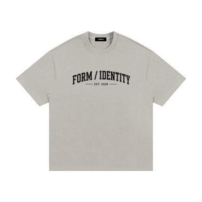 OMINA Studio Form / Identity heavyweight cotton t-shirt in light grey with a relaxed fit and collegiate-style graphic.