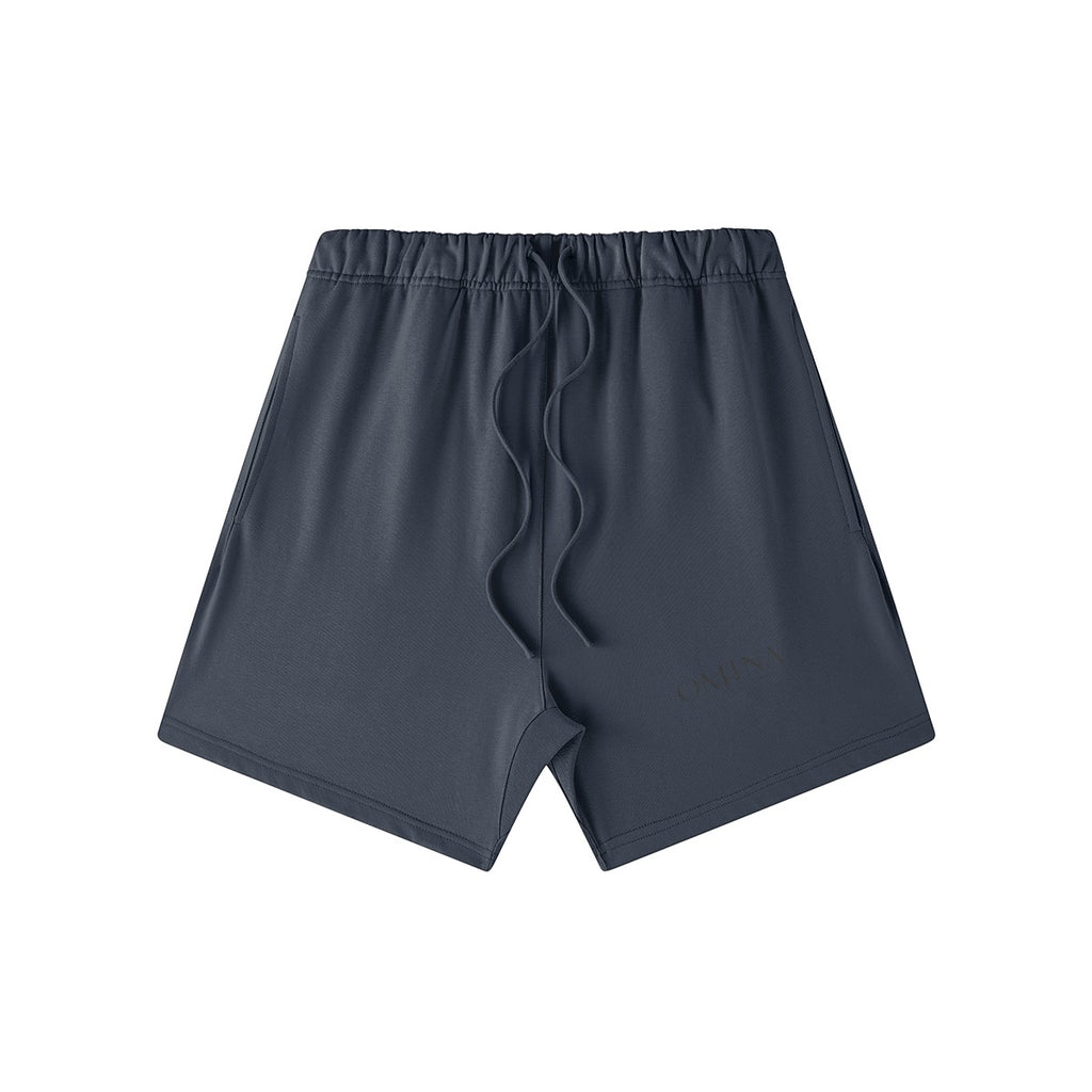 Omina Studio charcoal grey heavyweight French terry shorts with drawstring waist and subtle logo detail.